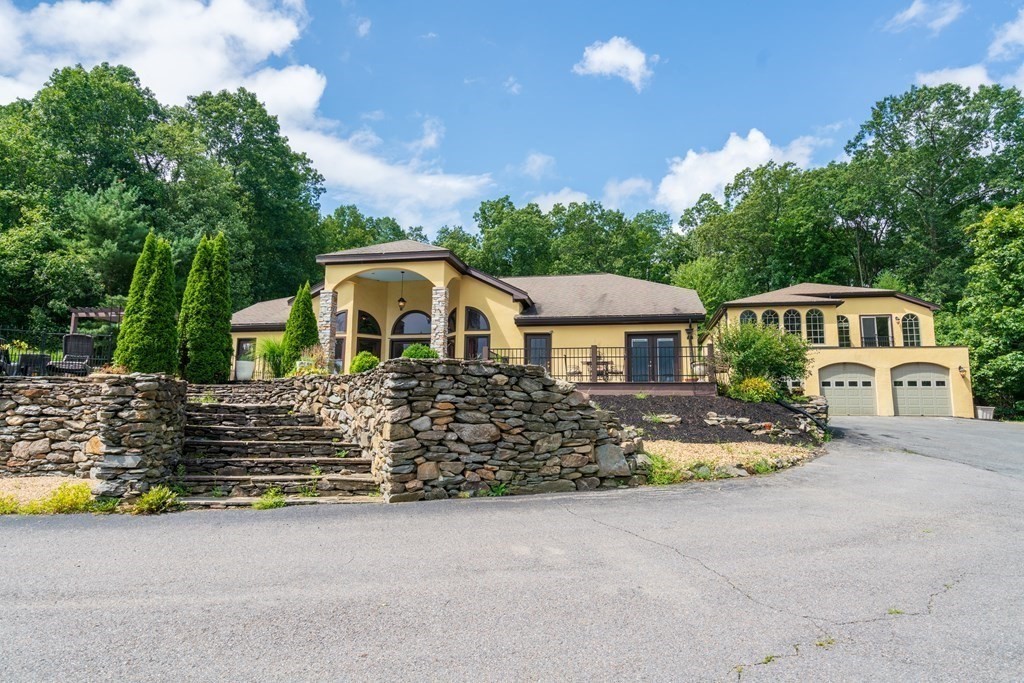 209 Langen Road Lancaster, MA 01523 - Photo 1 of 40 a front view of house with yard and trees in the background