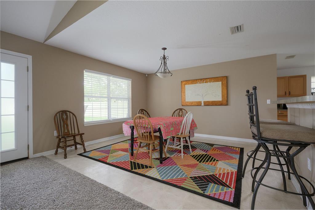 11 Riddle Drive Palm Coast, FL 32164 - Photo 6 of 33 a view of a dining room with furniture window and outside view
