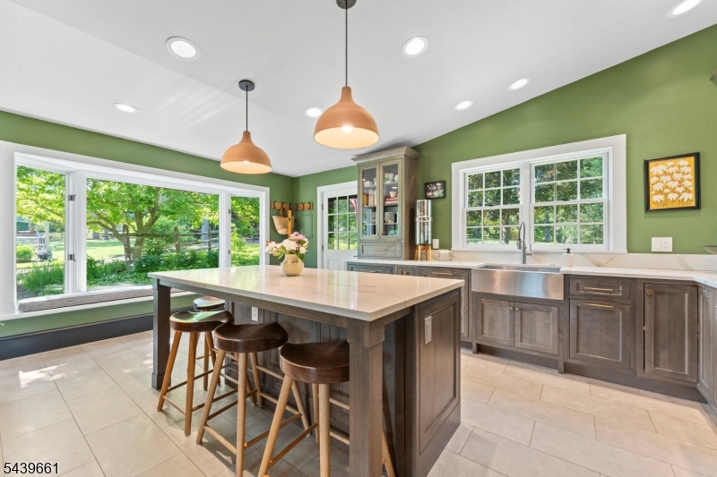 29 Bedens Brook Road Skillman, NJ 08558 - Photo 6 of 50 a kitchen with a stove a sink a counter space and dining table