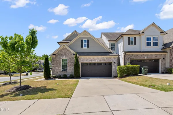 a front view of a house with yard