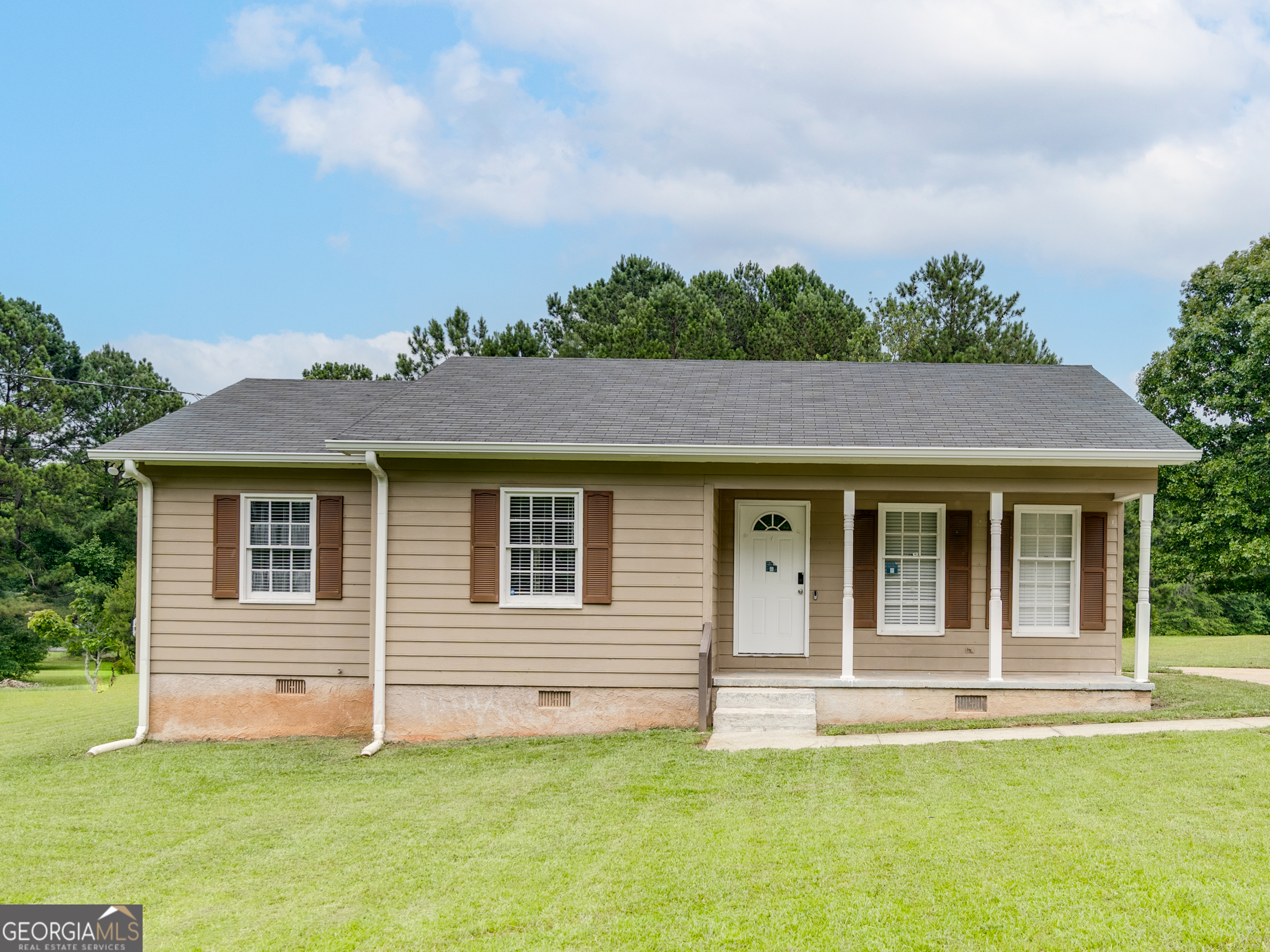63 Elder Road Hampton, GA 30228 - Photo 1 of 1 a view of a house with a yard