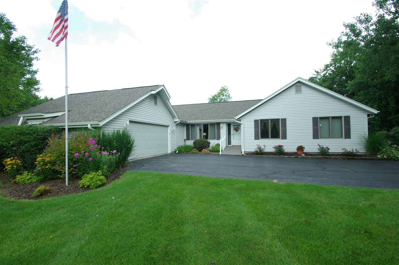 8638 Rote Road Rockford, IL 61107 - Photo 1 of 25 a front view of house with a garden