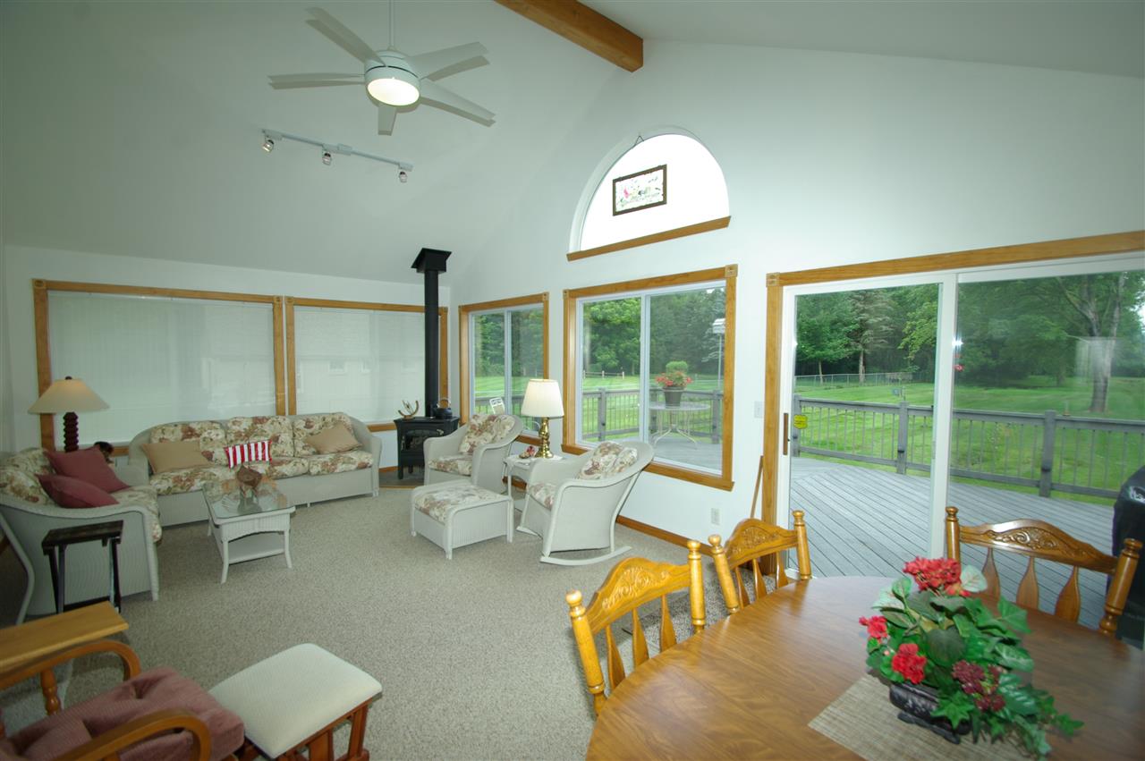 8638 Rote Road Rockford, IL 61107 - Photo 11 of 25 a living room with furniture and a large window