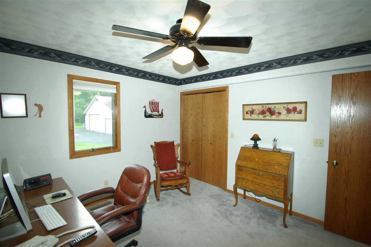 8638 Rote Road Rockford, IL 61107 - Photo 15 of 25 a room with furniture and windows