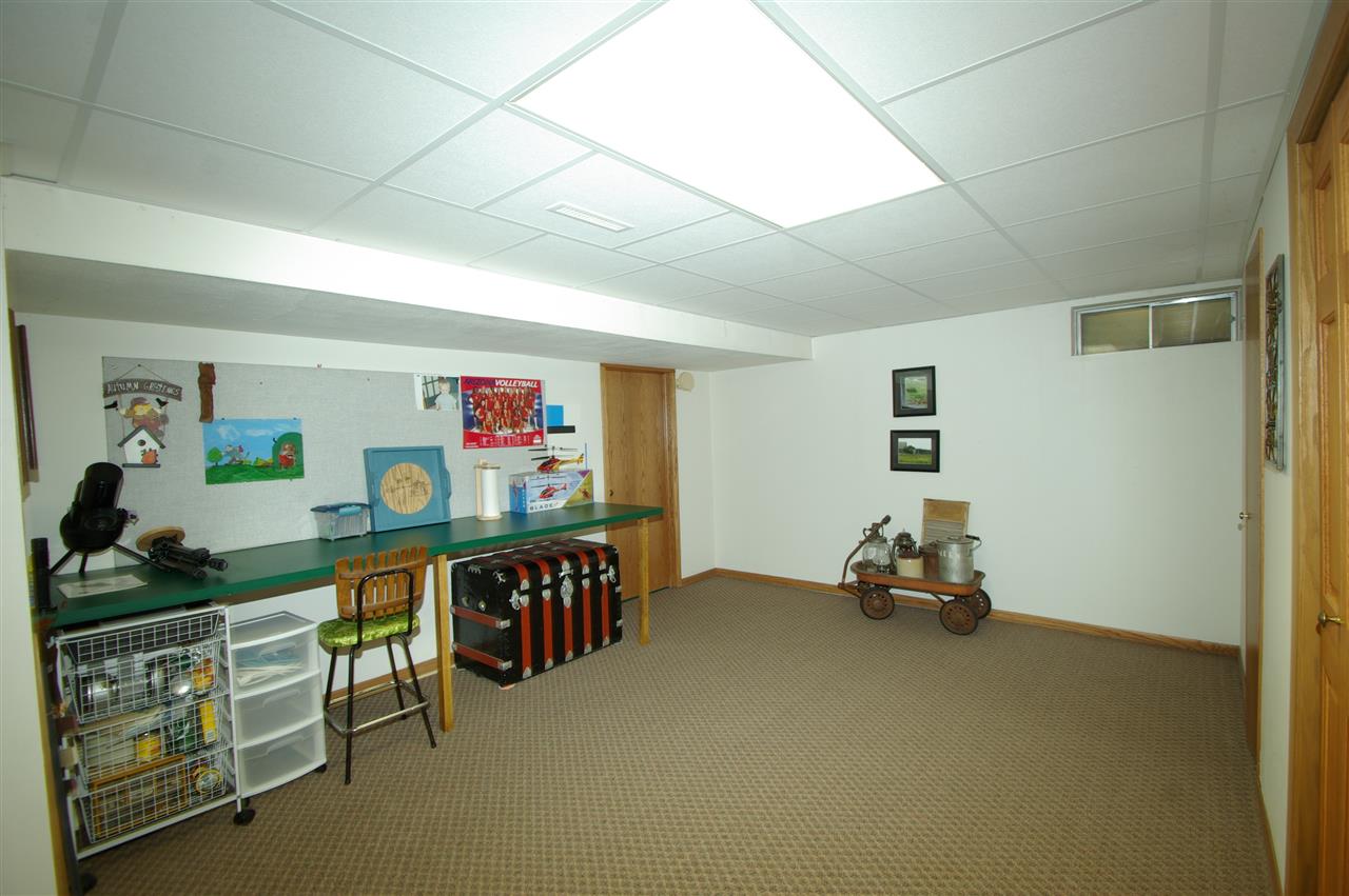 8638 Rote Road Rockford, IL 61107 - Photo 20 of 25 a view of game room with window and couch