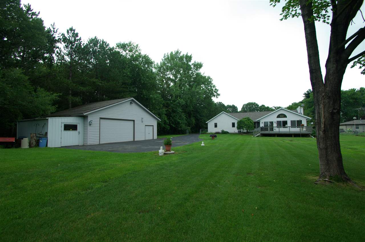8638 Rote Road Rockford, IL 61107 - Photo 23 of 25 a front view of a house with garden