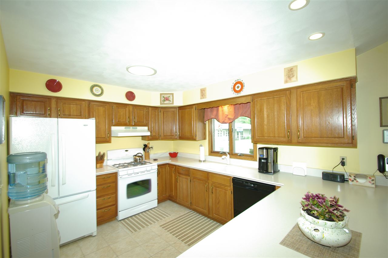 8638 Rote Road Rockford, IL 61107 - Photo 5 of 25 a kitchen with a sink appliances cabinets and a counter top space