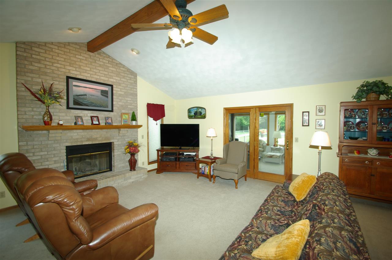 8638 Rote Road Rockford, IL 61107 - Photo 6 of 25 a living room with furniture and a fireplace