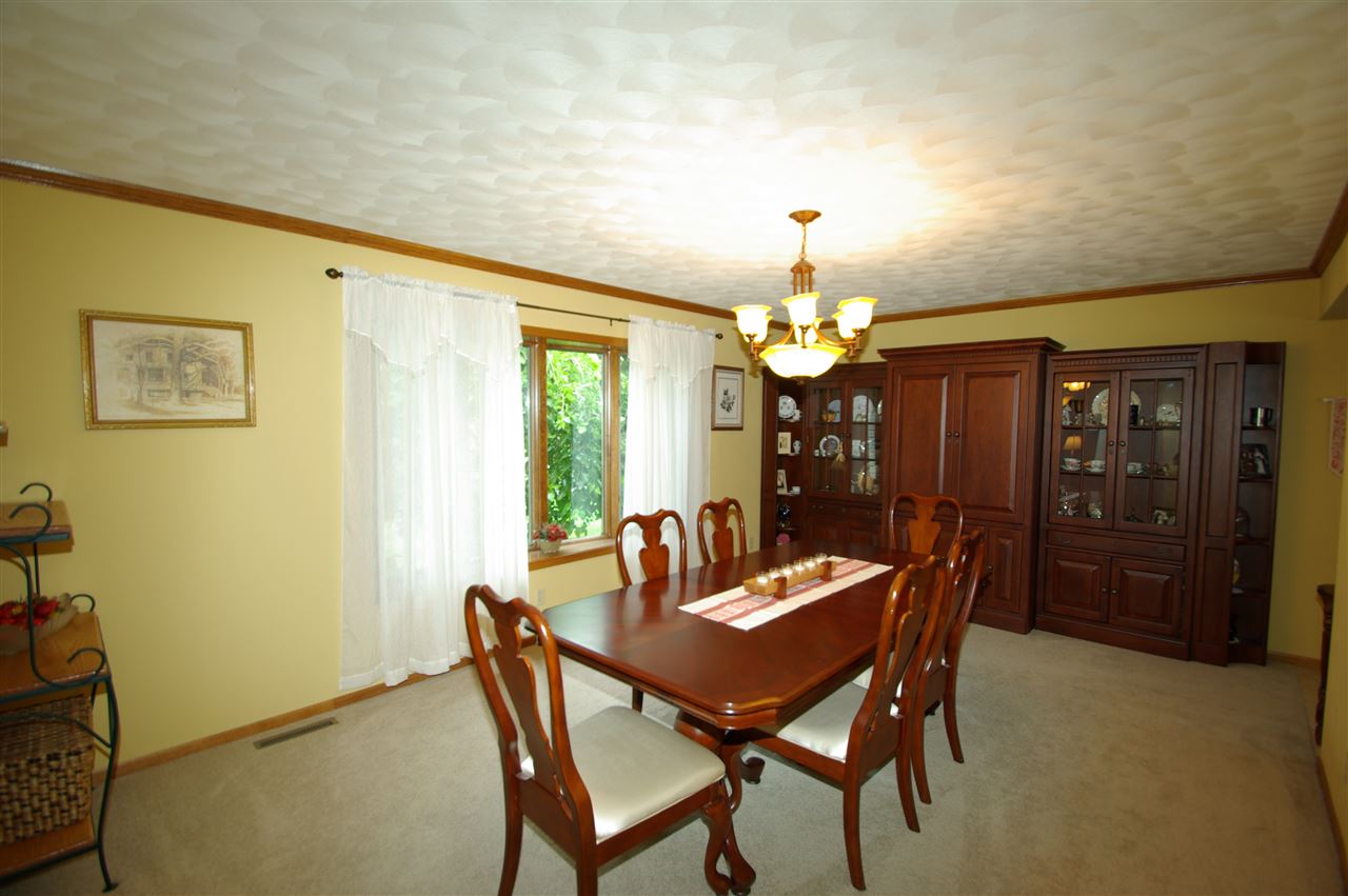 8638 Rote Road Rockford, IL 61107 - Photo 10 of 25 a dining room with furniture and window