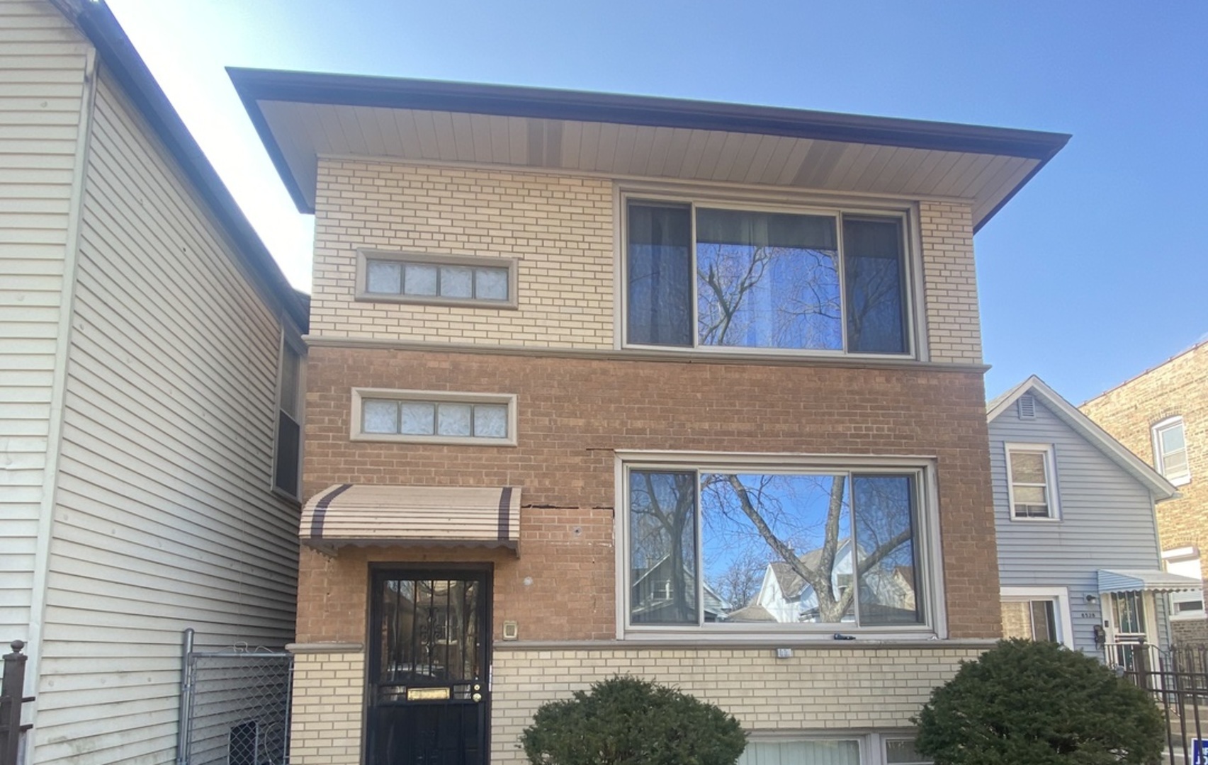 8530 South Carpenter Street, Unit 1 Chicago, IL 60620 - Photo 1 of 10 a front view of house with a garden