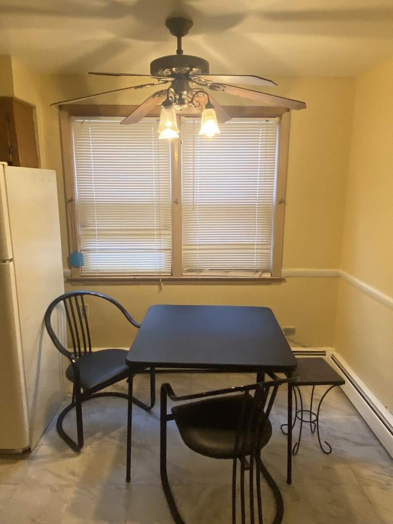 8530 South Carpenter Street, Unit 1 Chicago, IL 60620 - Photo 9 of 10 a view of a dining room with furniture and window
