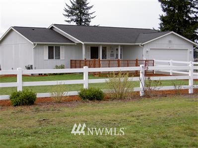 17845 Danby Drive Southwest Rochester, WA 98579 - Photo 1 of 1 a front view of a house with garden