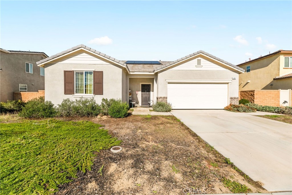 468 Bristolwood Road Hemet, CA 92543 - Photo 2 of 55 a front view of a house with a yard and garage