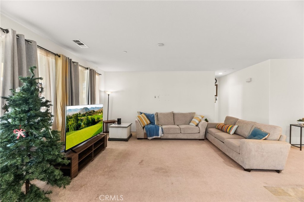 468 Bristolwood Road Hemet, CA 92543 - Photo 21 of 55 a living room with furniture and a large window