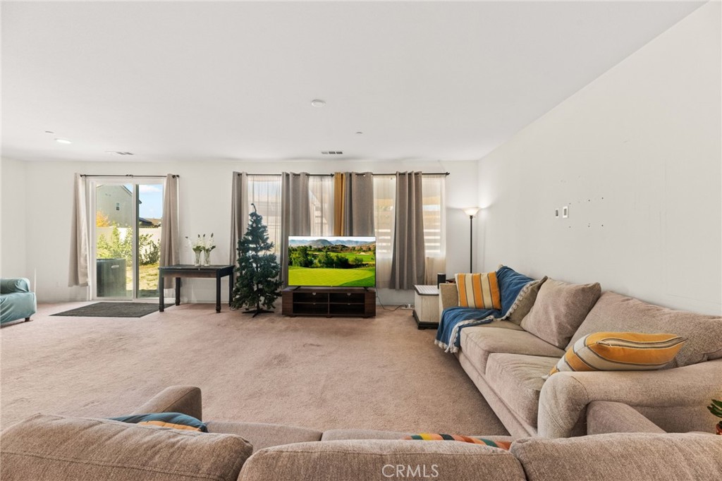 468 Bristolwood Road Hemet, CA 92543 - Photo 23 of 55 a living room with furniture and a window