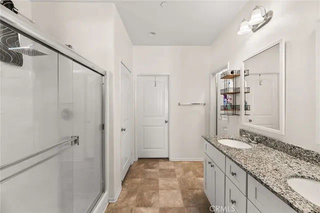 a white toilet sitting next to a white wall