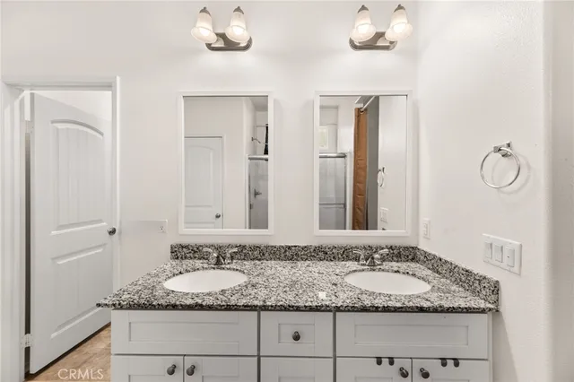 a bedroom with a bed a table and a window