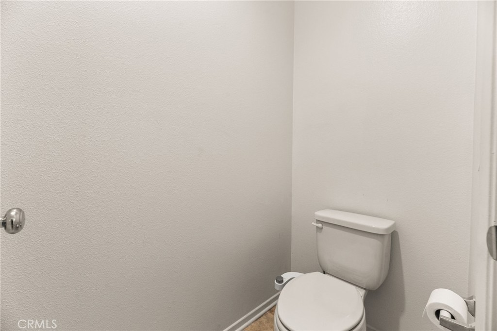 468 Bristolwood Road Hemet, CA 92543 - Photo 33 of 55 a white toilet sitting next to a white wall