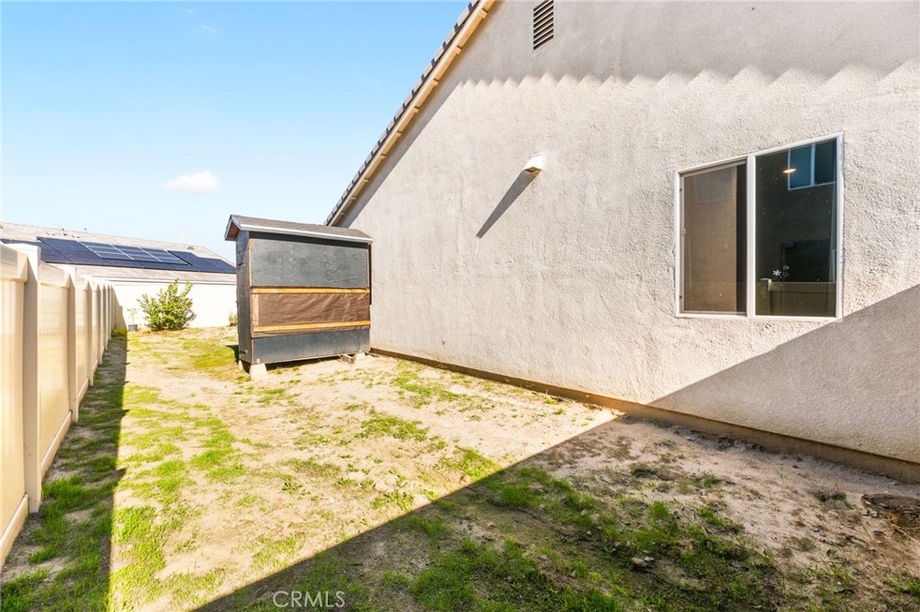 468 Bristolwood Road Hemet, CA 92543 - Photo 44 of 55 a bedroom with a bed and a large window