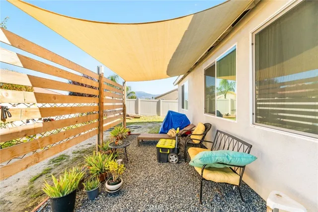 a view of a white house with a outdoor space