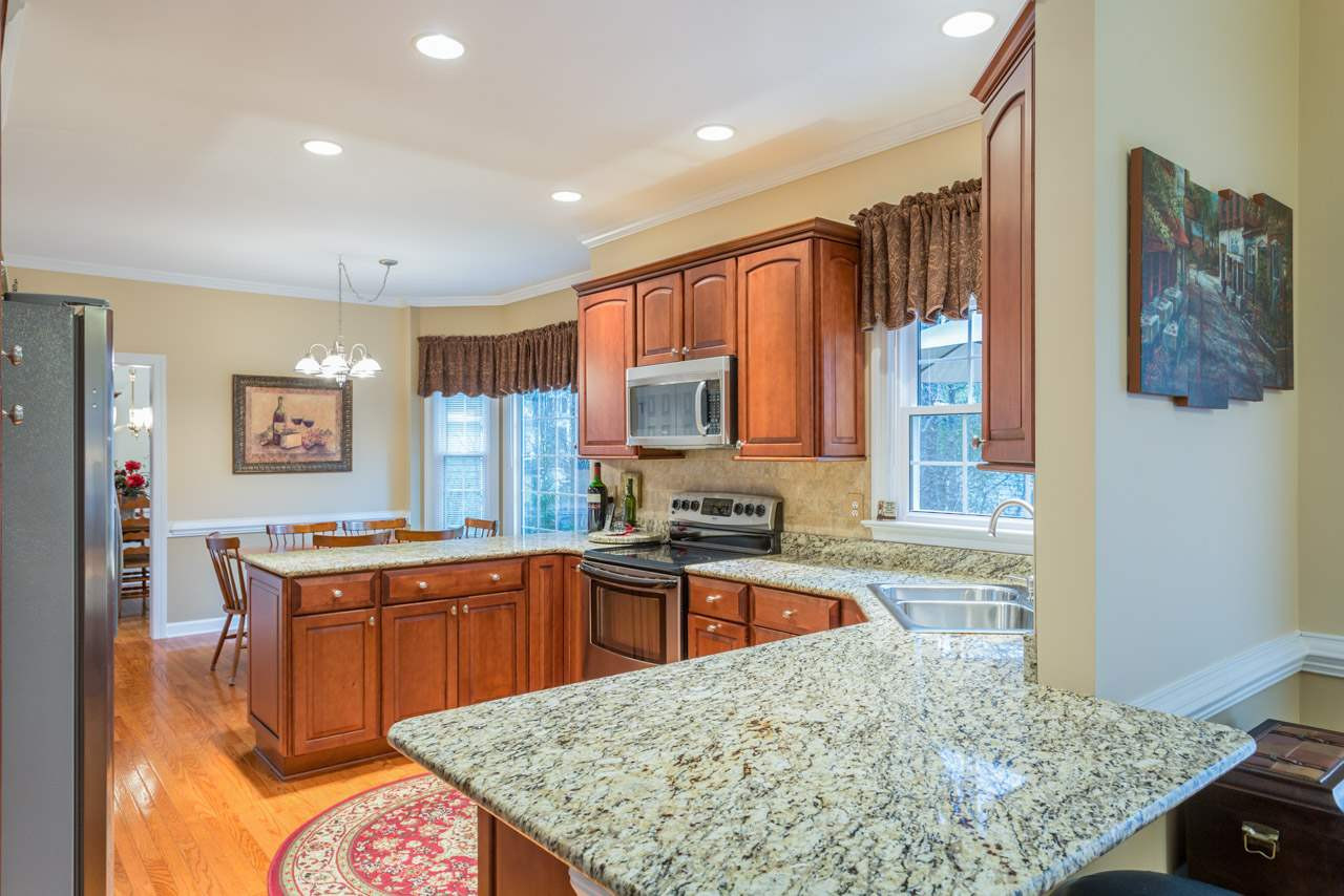 5409 Ingate Way Raleigh, NC 27613 - Photo 7 of 25 Hardwood Floors - Granite Counter Tops