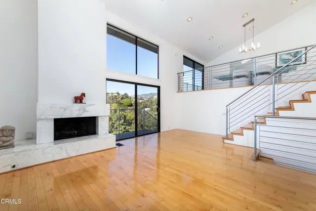 a view of a dining room with furniture and a potted plant