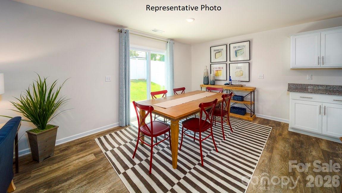 1371 Mammoth Road Hickory, NC 28602 - Photo 13 of 34 a view of a dining room with furniture window and wooden floor