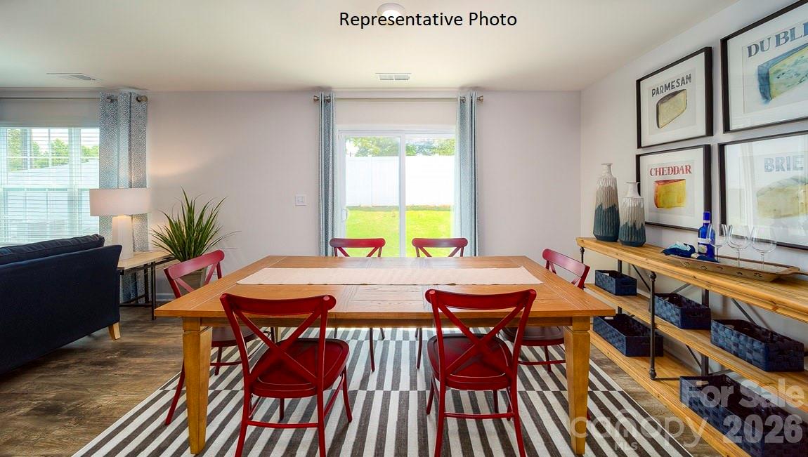 1371 Mammoth Road Hickory, NC 28602 - Photo 14 of 34 a view of a dining room with furniture window and wooden floor