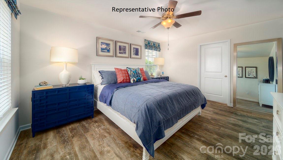 1371 Mammoth Road Hickory, NC 28602 - Photo 18 of 34 a bed room with a bed and a chandelier