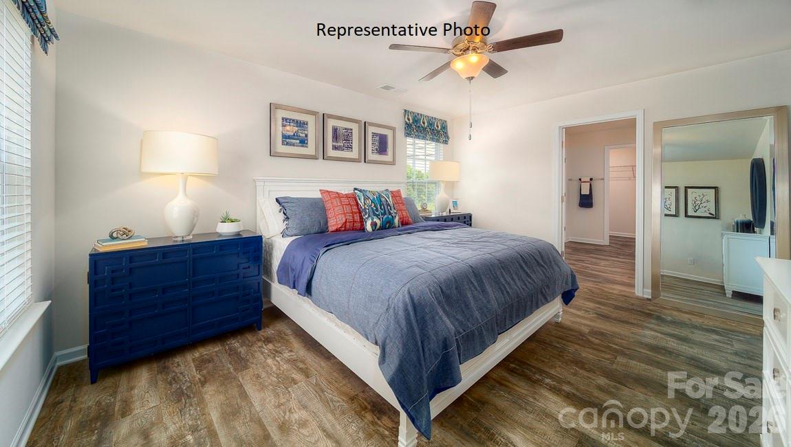 1371 Mammoth Road Hickory, NC 28602 - Photo 19 of 34 a bed room with a bed and a chandelier