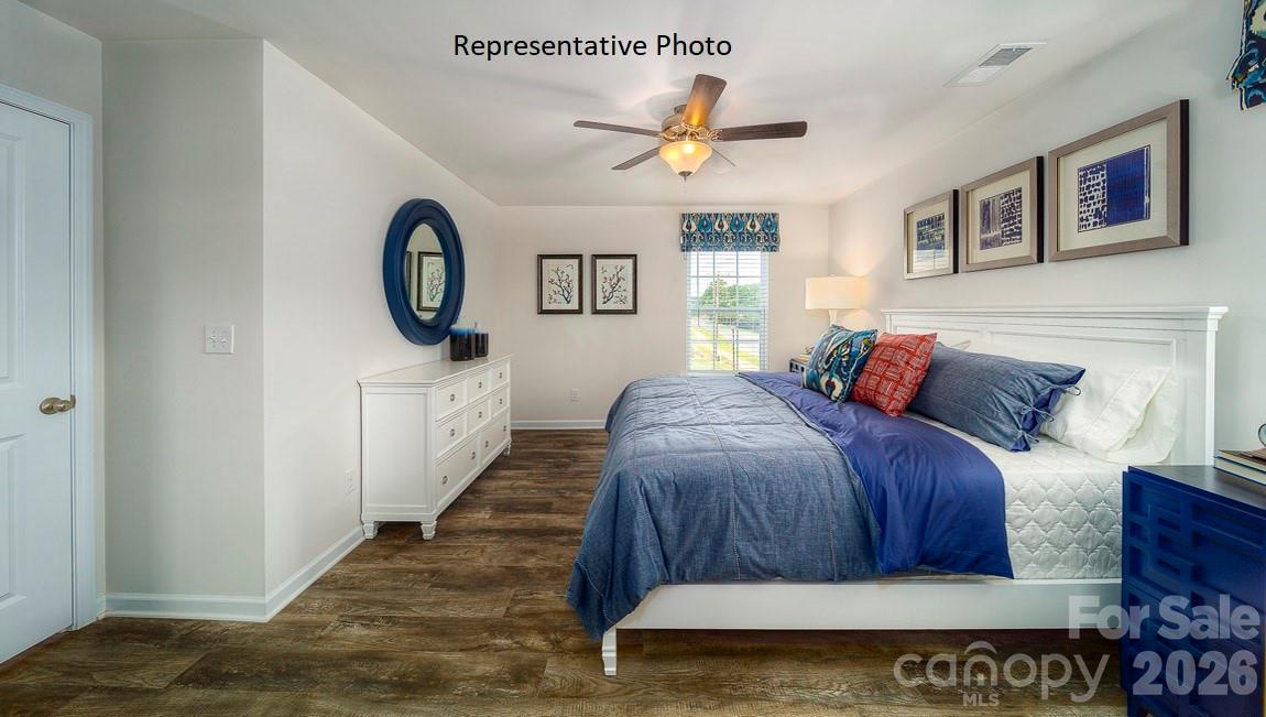 1371 Mammoth Road Hickory, NC 28602 - Photo 20 of 34 a bedroom with a bed and a wall painting
