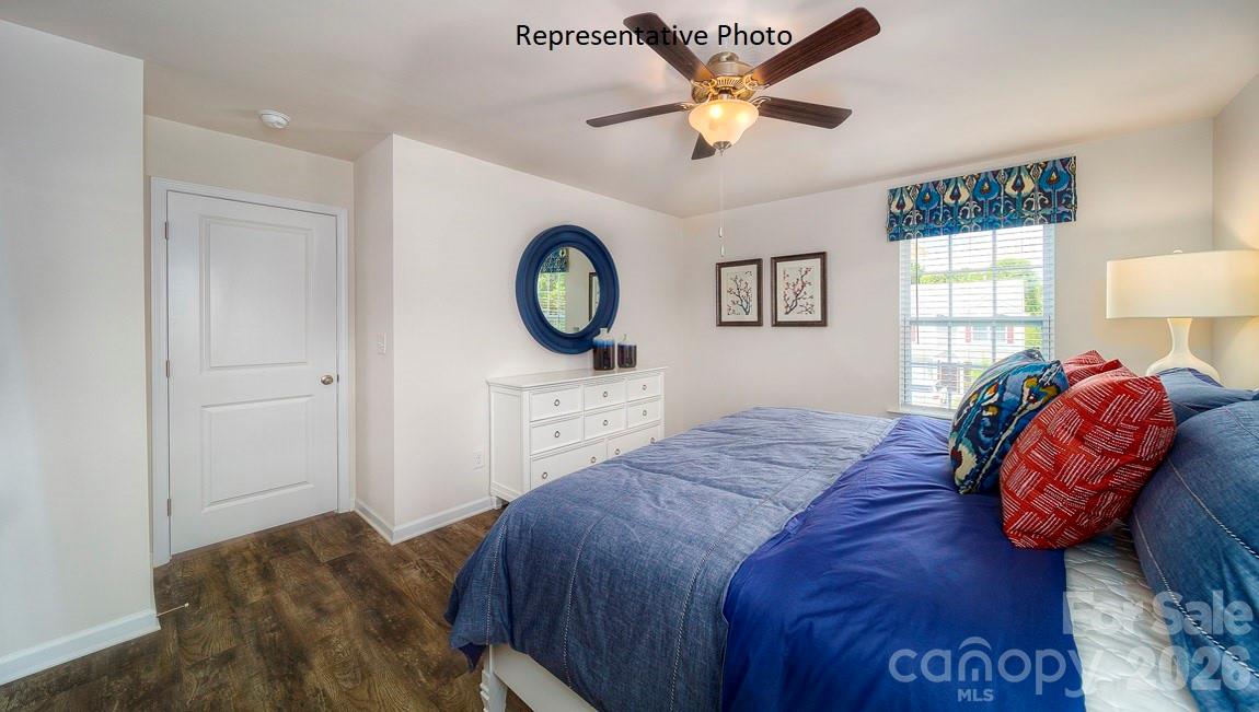 1371 Mammoth Road Hickory, NC 28602 - Photo 21 of 34 a bedroom with a bed and a chandelier