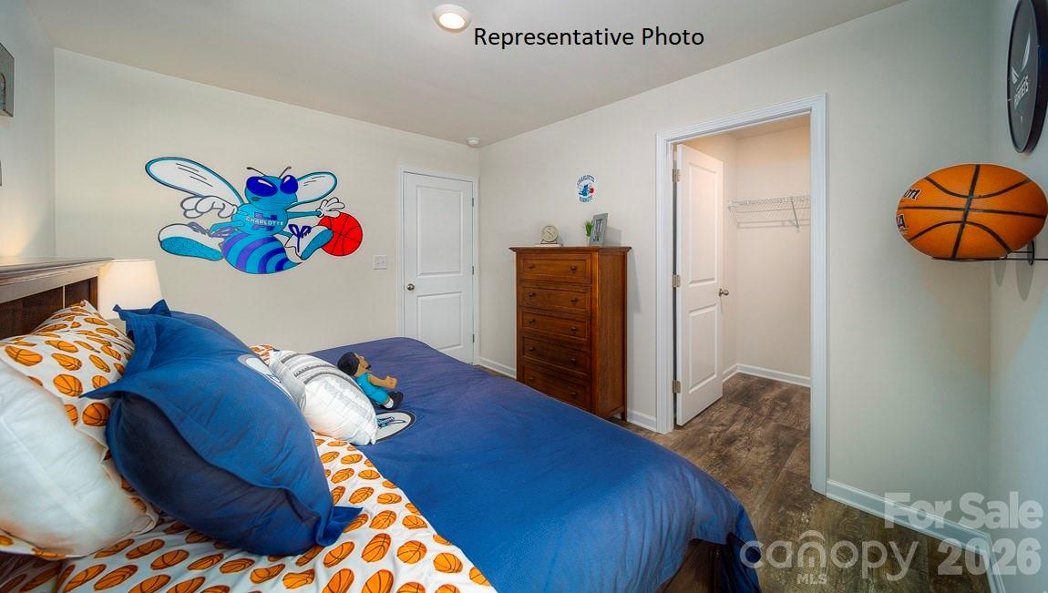 1371 Mammoth Road Hickory, NC 28602 - Photo 26 of 34 a bedroom with a bed and painting on the wall