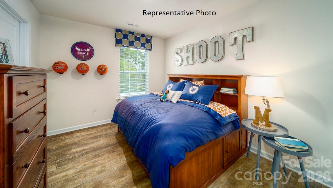 1371 Mammoth Road Hickory, NC 28602 - Photo 27 of 34 a bedroom with a bed and a painting on the wall