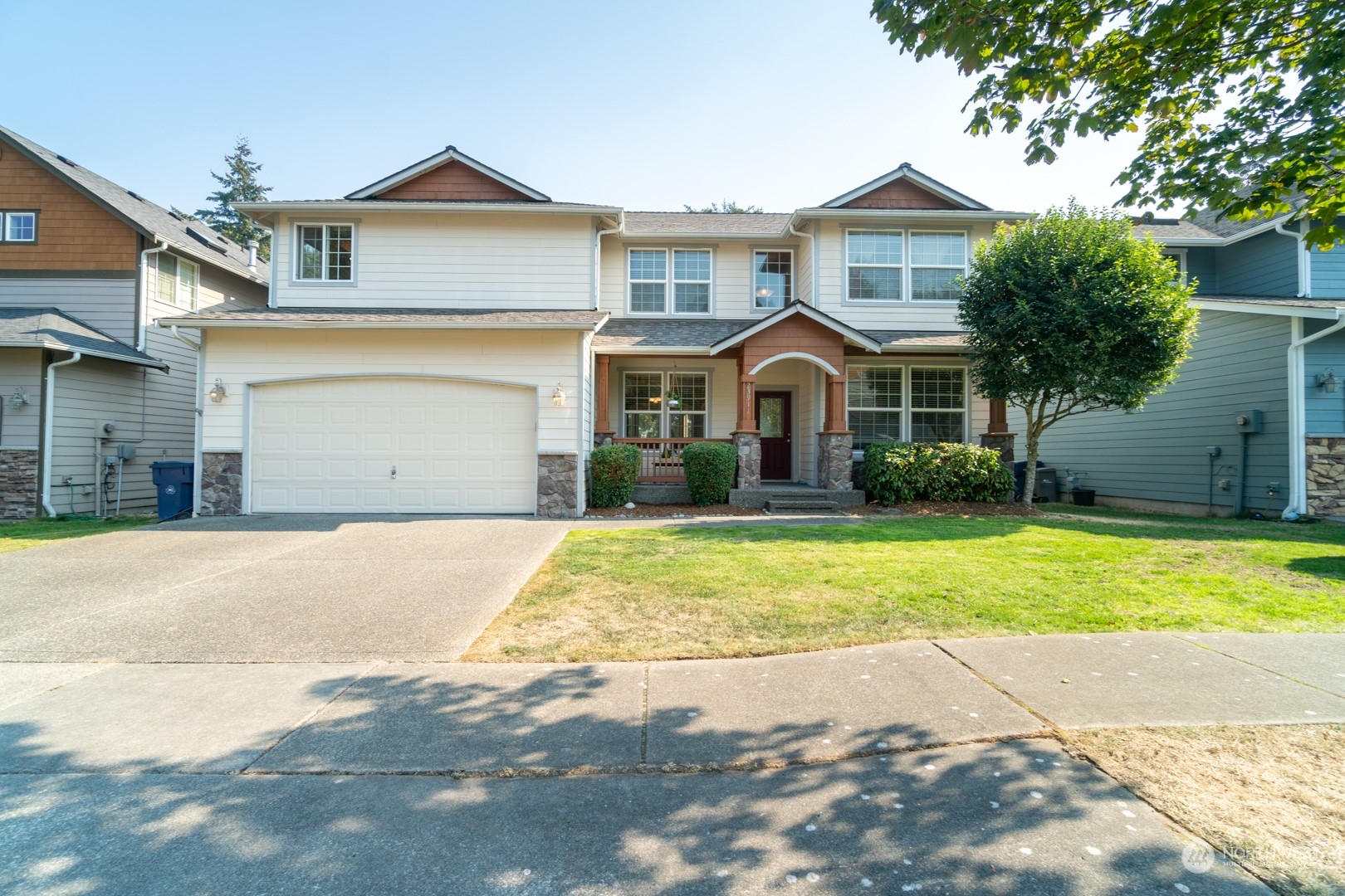 23911 22nd Avenue West Bothell, WA 98021 - Photo 1 of 27 a front view of a house with a yard and garage