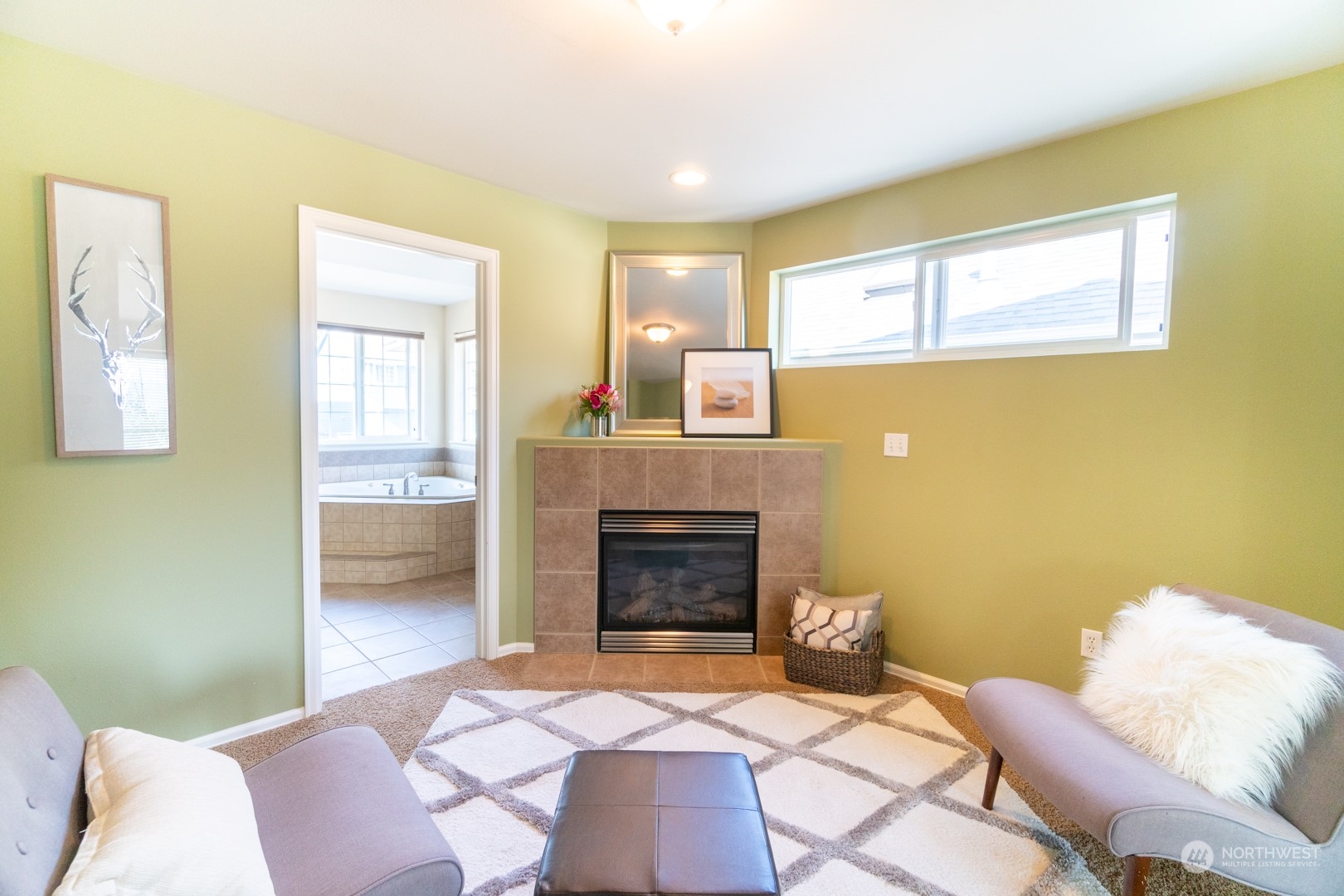 23911 22nd Avenue West Bothell, WA 98021 - Photo 19 of 27 a bedroom with a bed and a fireplace