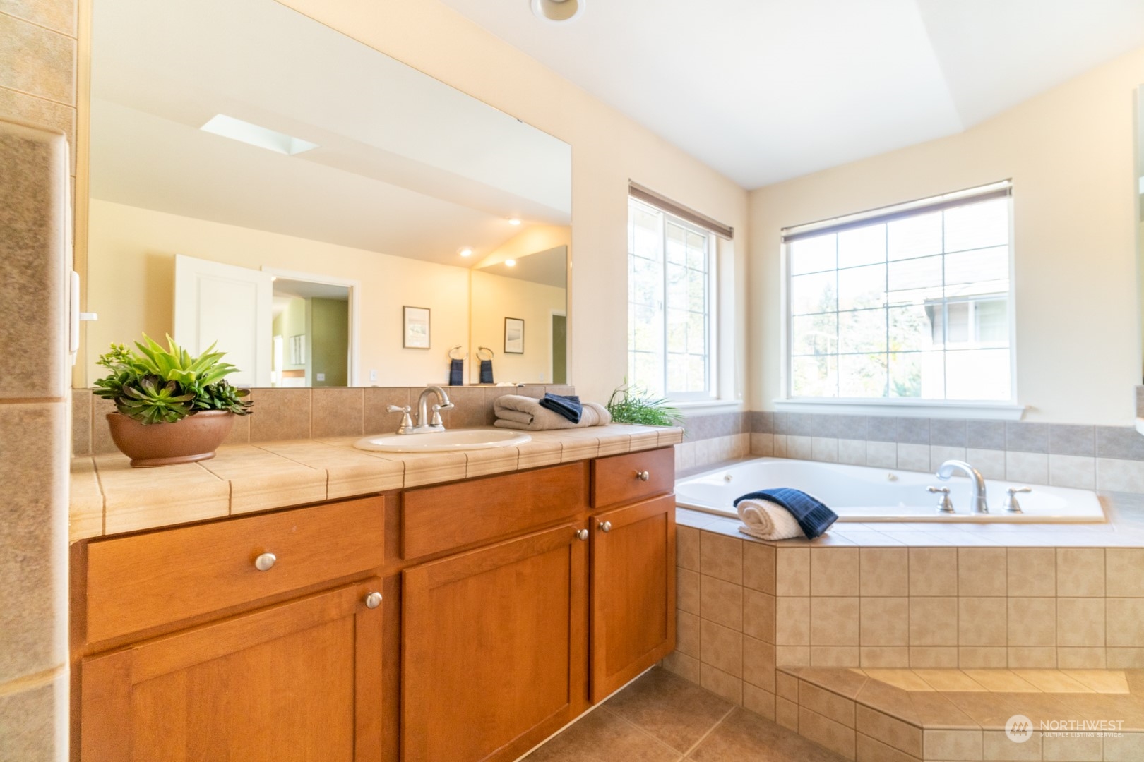 23911 22nd Avenue West Bothell, WA 98021 - Photo 22 of 27 a bathroom with a sink double vanity and a mirror