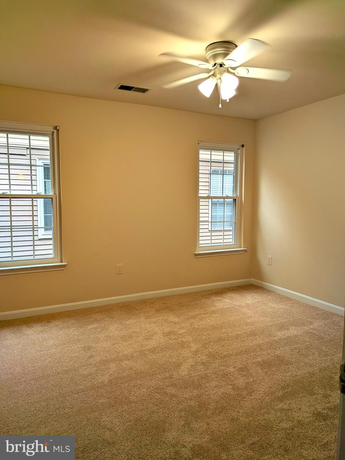 109 Timberbrook Lane, Unit 301 Gaithersburg, MD 20878 - Photo 14 of 22 a view of an empty room with a window