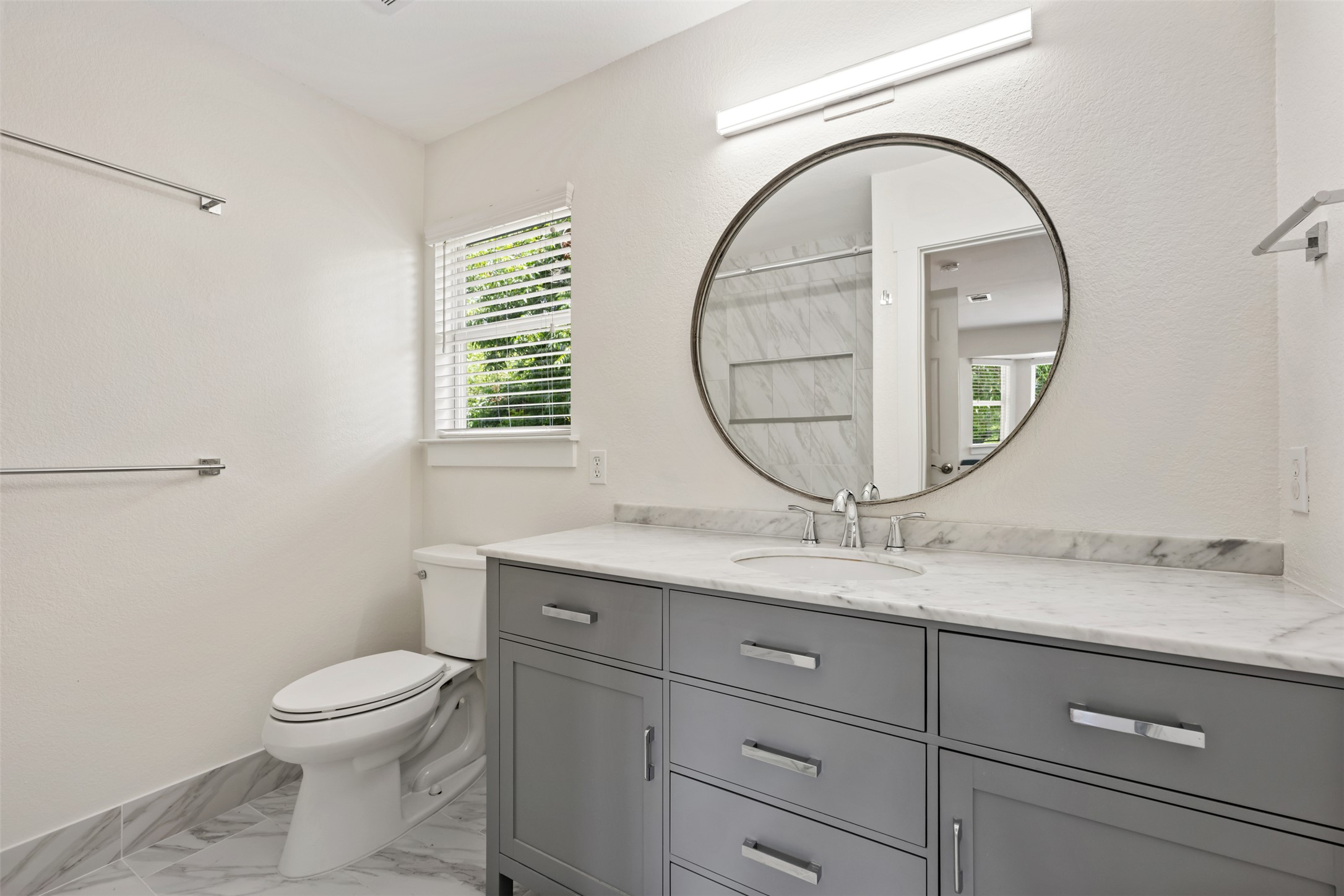 4912 Sara Drive, Unit A Austin, TX 78721 - Photo 21 of 28 Primary bathroom with walk-in shower and oversized vanity.
