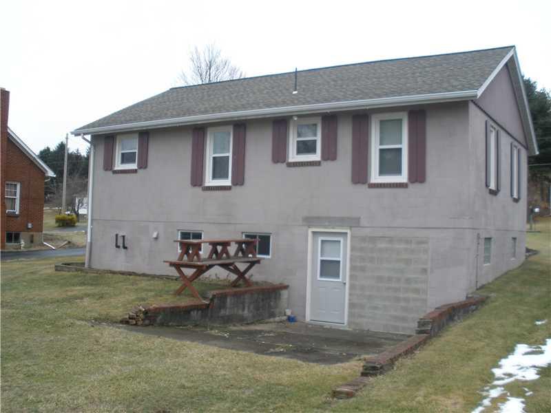 179 Old Rte 217 Derry, PA 15627 - Photo 2 of 11 Exterior Back. Basement entrance plus room for a patio. Nice level yard