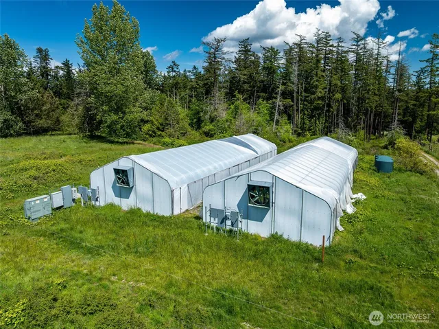 a aerial view of a house with pool