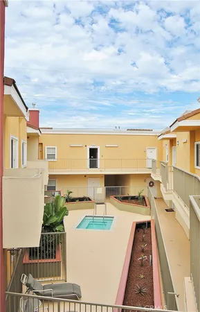 a view of swimming pool with an outdoor seating