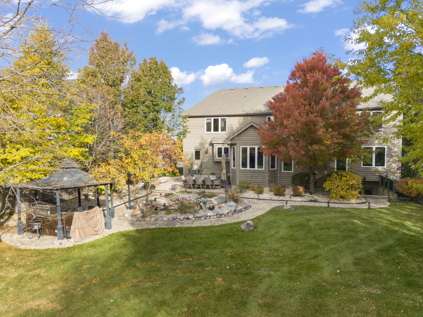 4012 Champion Road Naperville, IL 60564 - Photo 44 of 47 a view of a house with backyard sitting area and garden