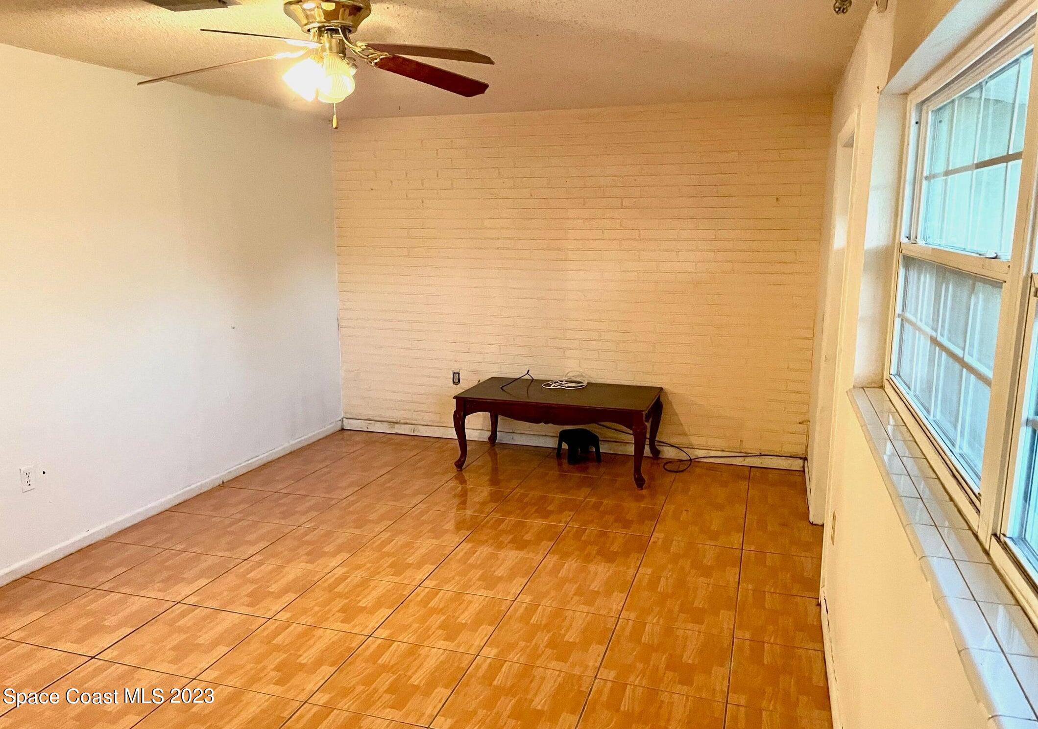 245 Richards Road Melbourne Beach, FL 32951 - Photo 3 of 18 a room with a table and chair