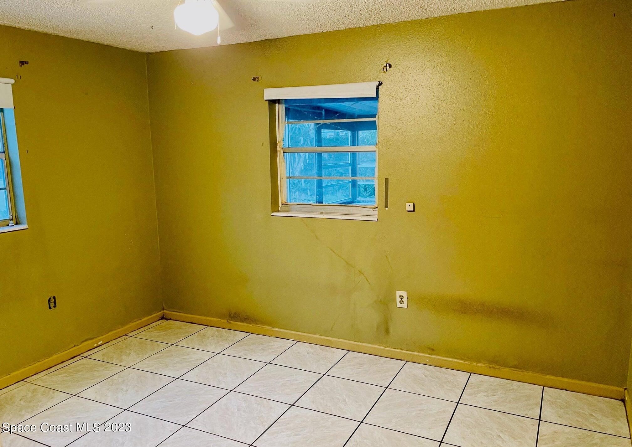 245 Richards Road Melbourne Beach, FL 32951 - Photo 8 of 18 a view of a room with window