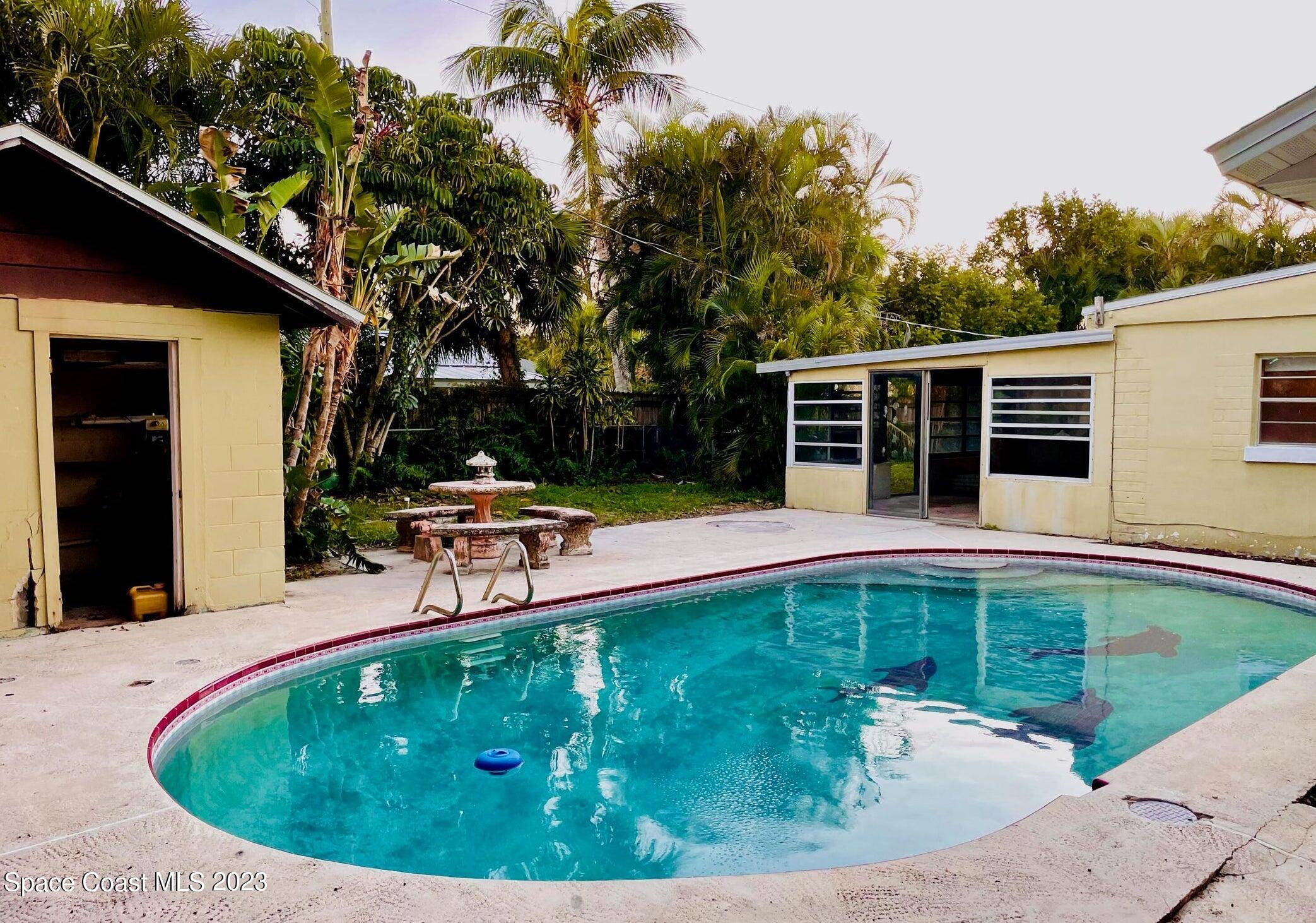 245 Richards Road Melbourne Beach, FL 32951 - Photo 10 of 18 a view of a swimming pool with a patio