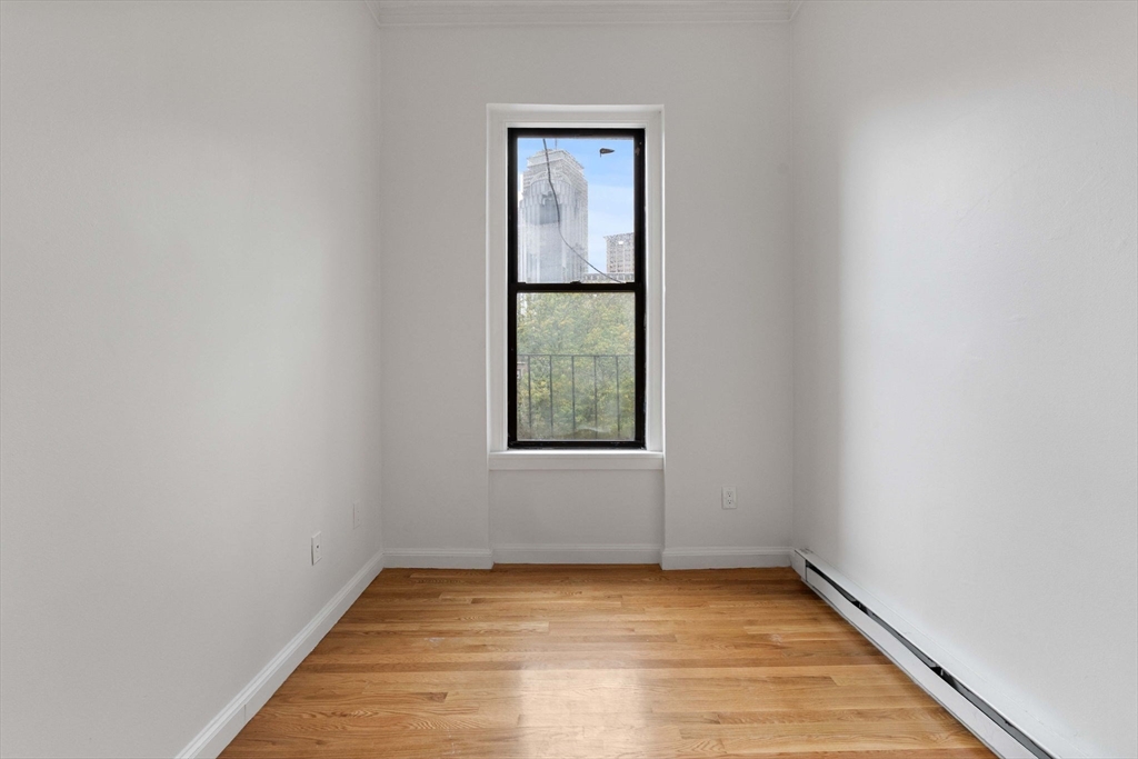 431 Columbus Avenue, Unit 4 Boston, MA 02116 - Photo 17 of 27 a view of an empty room with window