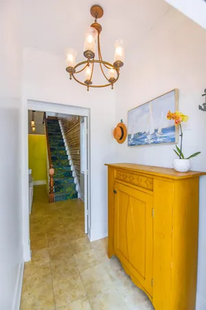 a bedroom with a bed and a flat tv screen on dresser