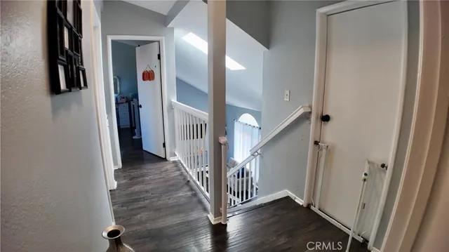 a bedroom with furniture and a flat screen tv