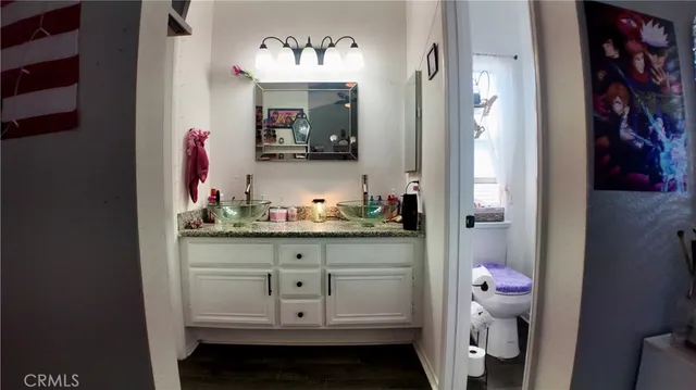 a bed room with a bed and a chair